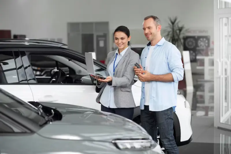 What Makes A Great Dealership Experience? Inside The Modern Car-Buying Journey 4 close up customer with business person car dealership 23 2149117147